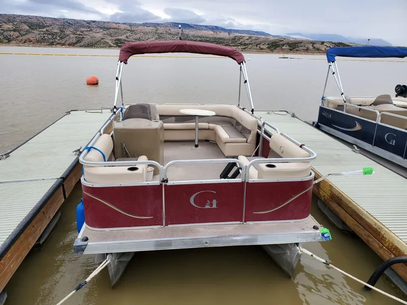 Slide: The Image of Custom 1987 tour boat docked on a lake with scenic mountain backdrop. - 18