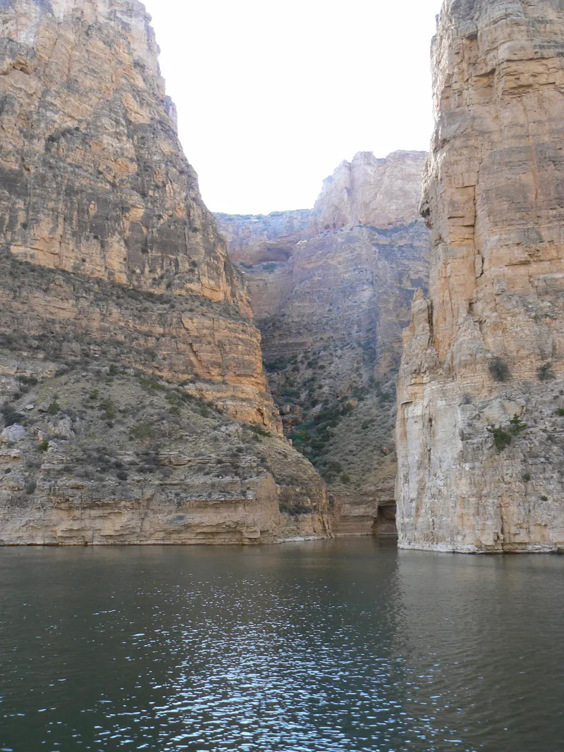 Slide: The Image of Scenic canyon view with calm river and towering rock formations. - 32