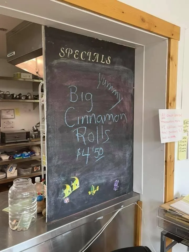 Slide: The Image of Chalkboard menu in a cafe advertising big cinnamon rolls for $4.50. - 36