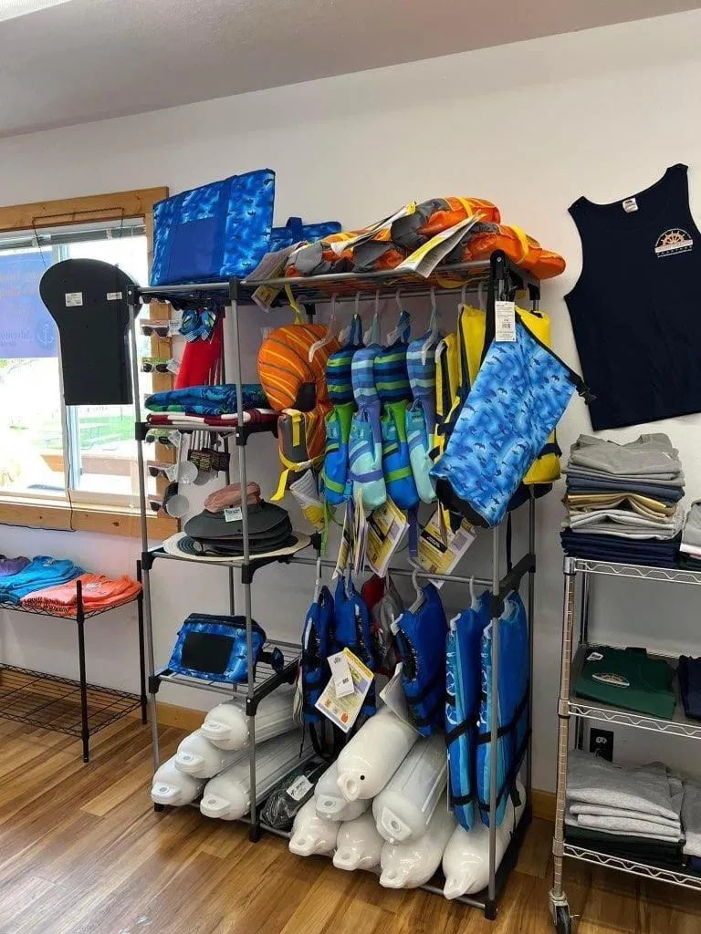 Slide: The Image of Life jackets and water sports gear displayed in a tour boat business shop. - 37
