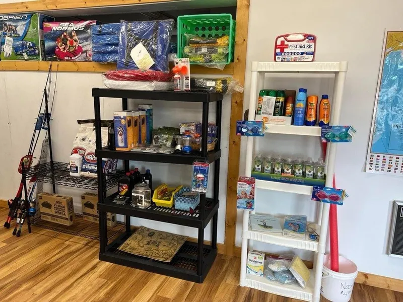 Slide: The Image of Fishing and boating supplies displayed on shelves in a store with wooden flooring. - 38