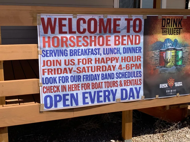 Slide: The Image of Welcome to Horseshoe Bend sign, offering meals, happy hour, boat tours, and rentals, open daily. - 41