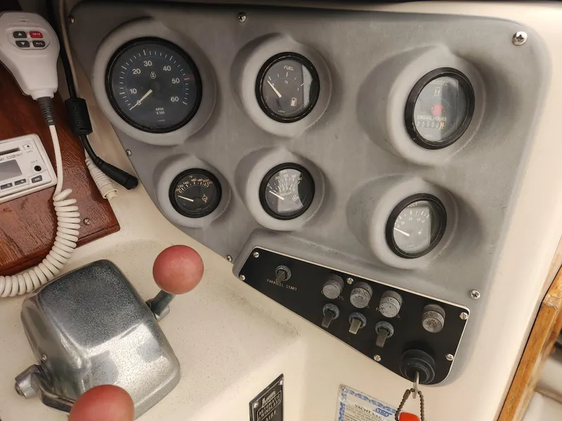 Slide: The Image of 1988 Silverton 40 Convertible dashboard with gauges and controls. - 11