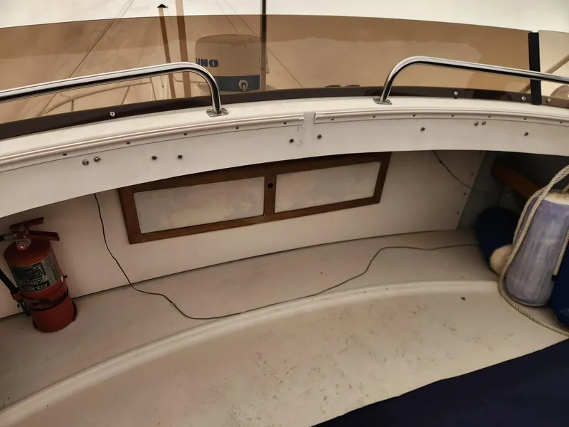 Slide: The Image of 1988 Silverton 40 Convertible boat interior with fire extinguisher and storage compartment. - 14