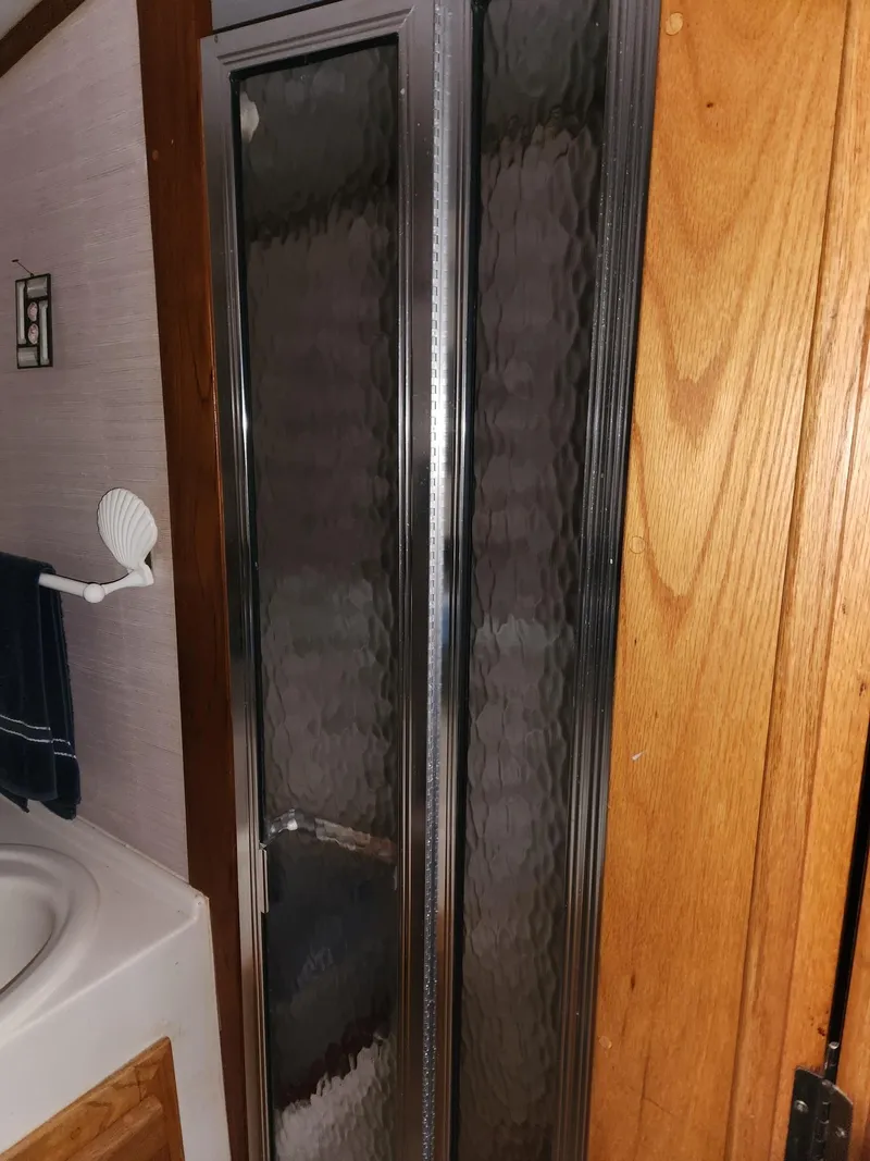 Slide: The Image of Shower area in 1988 Silverton 40 Convertible boat bathroom. - 21