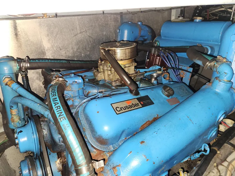 Slide: The Image of 1988 Silverton 40 Convertible engine, Crusader model, blue with visible hoses and components. - 25
