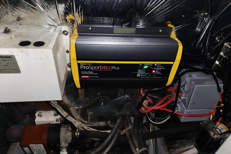 Slide: The Image of Battery charger setup in 1988 Silverton 40 Convertible boat engine room. - 28