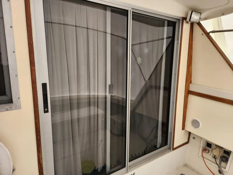 Slide: The Image of Sliding glass door on 1988 Silverton 40 Convertible boat interior. - 8