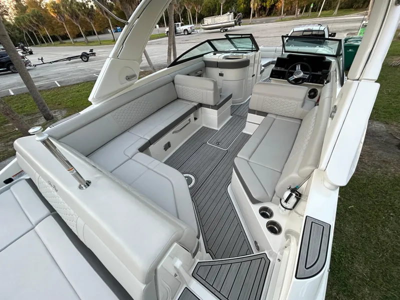 Slide: The Image of 2022 Sea Ray SDX 270 Outboard boat interior with spacious seating and modern design. - 12