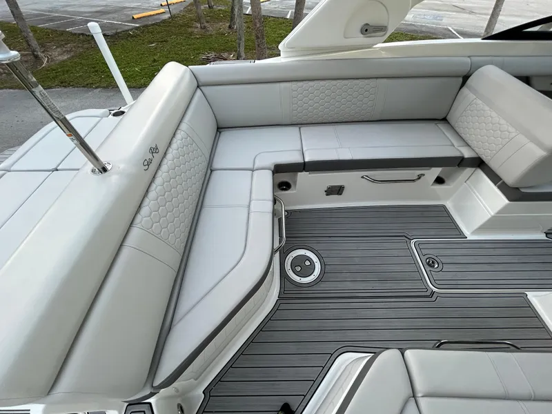Slide: The Image of 2022 Sea Ray SDX 270 Outboard boat interior with luxurious seating and modern flooring. - 13
