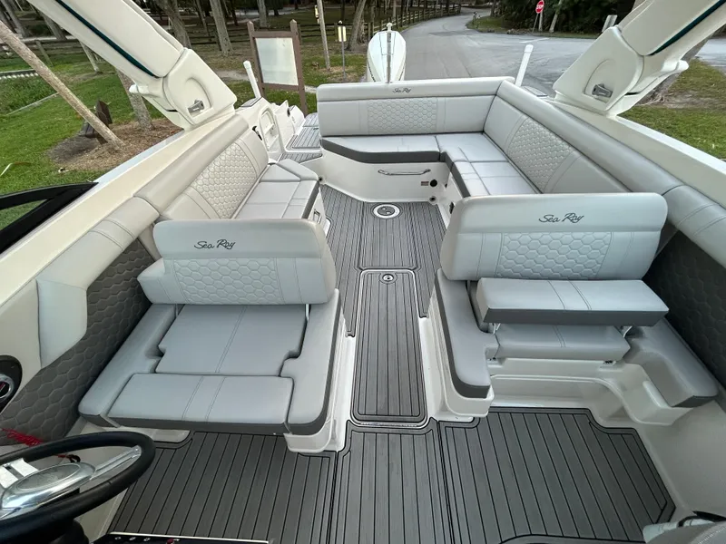 Slide: The Image of 2022 Sea Ray SDX 270 Outboard boat interior with spacious seating and modern design. - 15