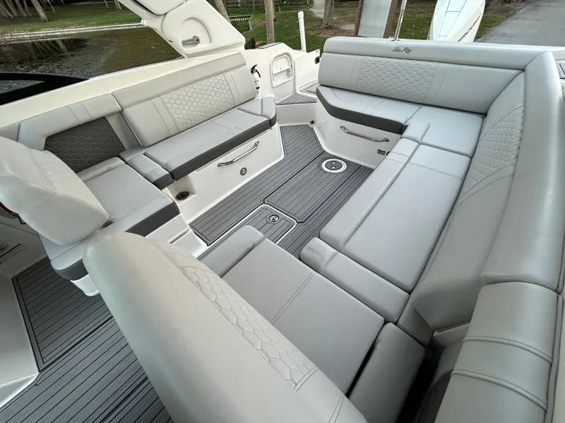 Slide: The Image of 2022 Sea Ray SDX 270 Outboard boat interior with luxurious seating. - 16