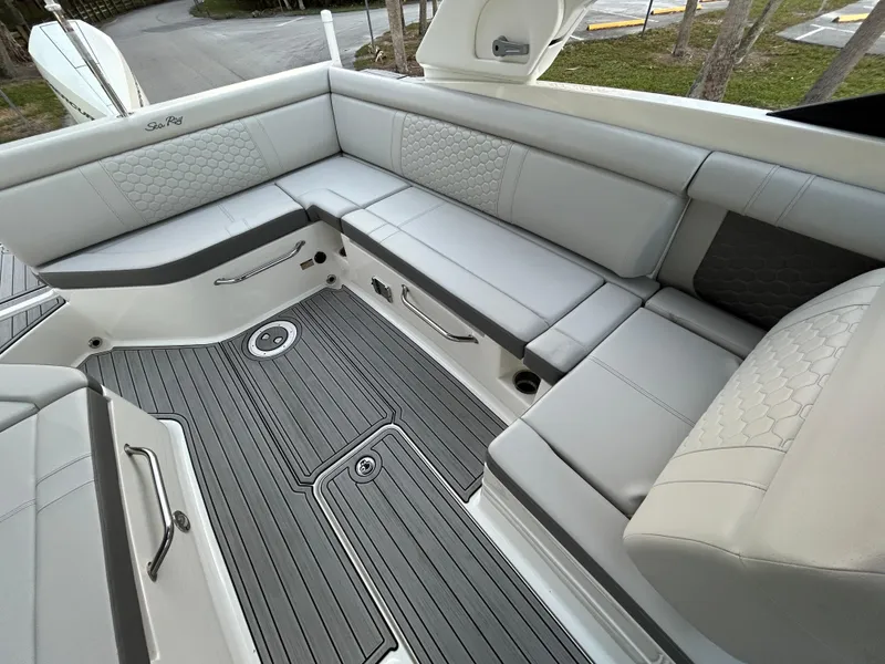 Slide: The Image of 2022 Sea Ray SDX 270 Outboard boat interior with gray seating and flooring. - 17