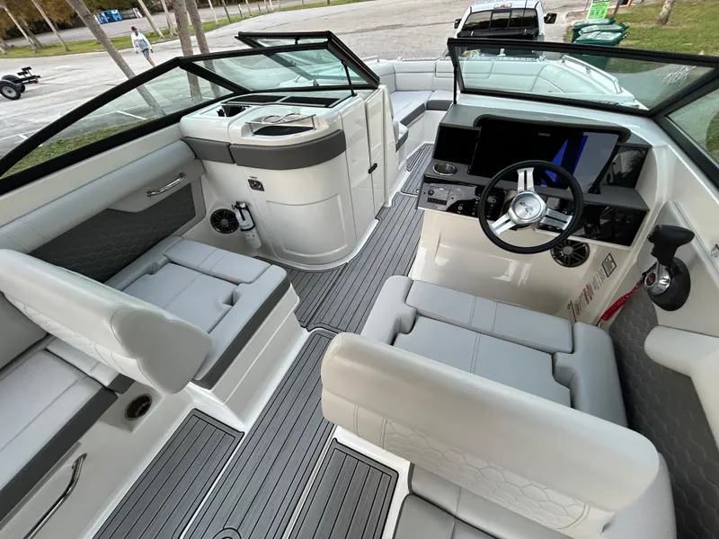Slide: The Image of 2022 Sea Ray SDX 270 Outboard boat interior with modern seating and dashboard. - 19