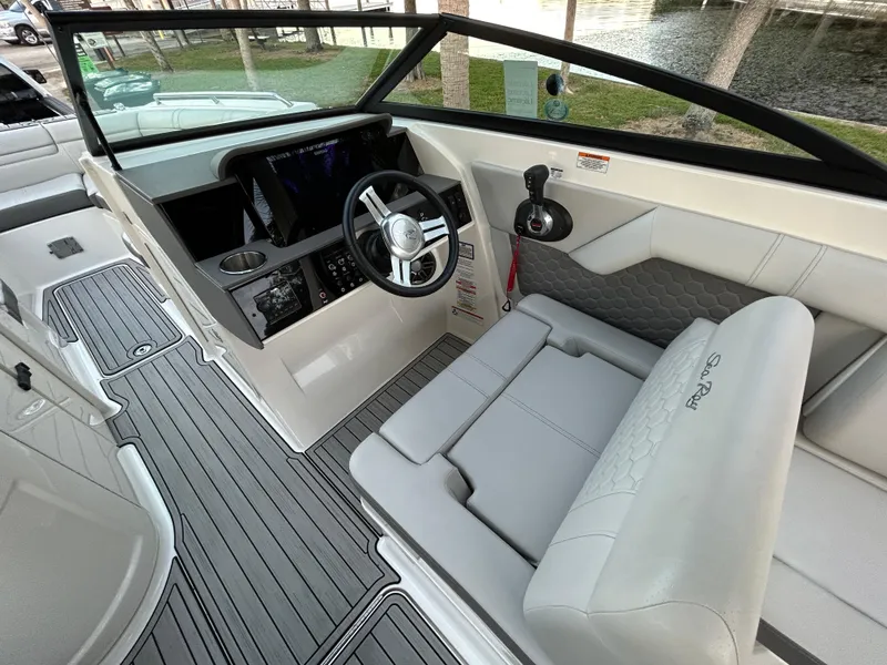 Slide: The Image of 2022 Sea Ray SDX 270 Outboard boat cockpit with modern helm and seating. - 20