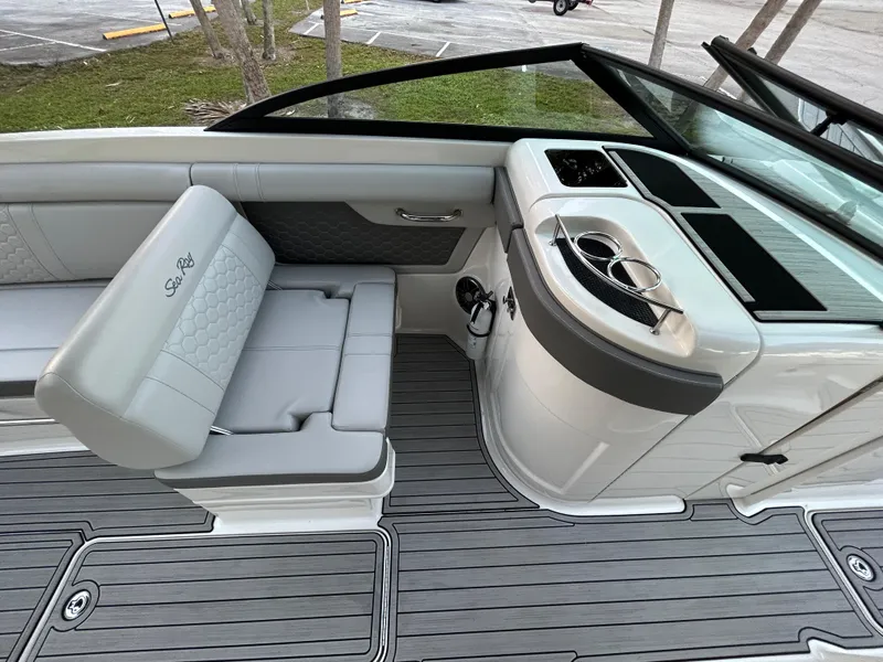 Slide: The Image of 2022 Sea Ray SDX 270 Outboard boat interior with seating and console. - 21