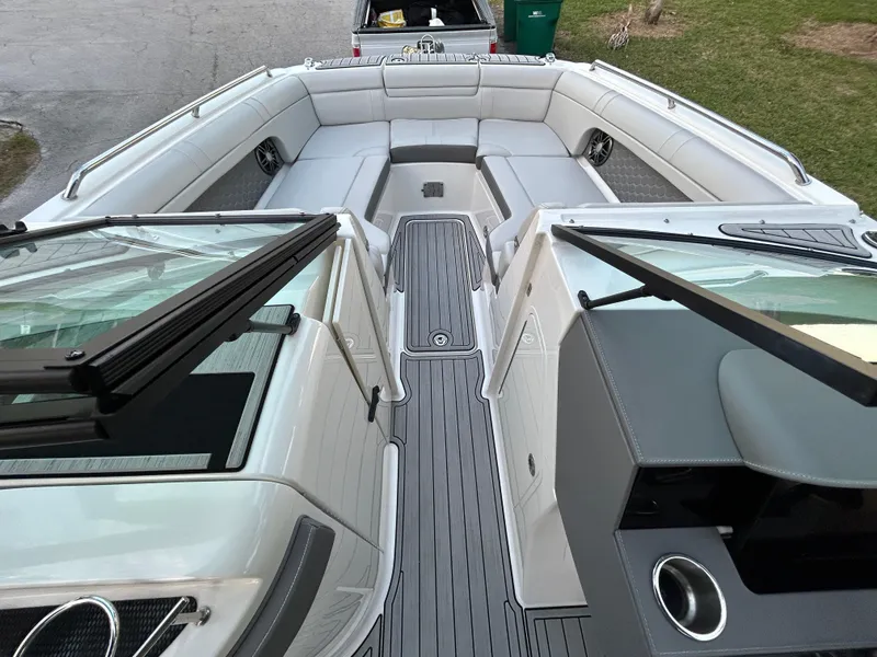 Slide: The Image of 2022 Sea Ray SDX 270 Outboard boat interior with spacious seating and modern design. - 28