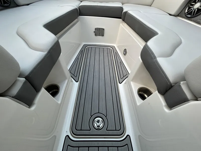 Slide: The Image of 2022 Sea Ray SDX 270 Outboard boat interior with gray seating and non-slip flooring. - 38