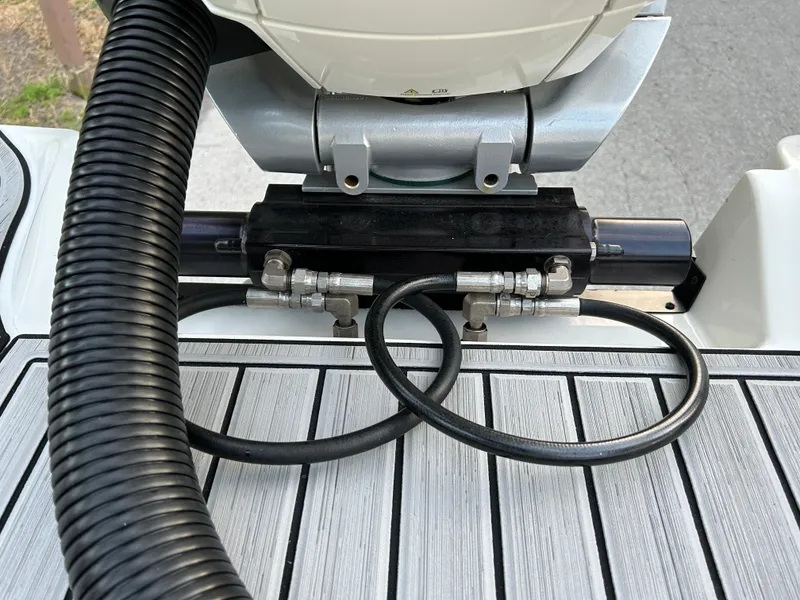 Slide: The Image of Close-up of the 2022 Sea Ray SDX 270 Outboard engine and hydraulic system. - 43