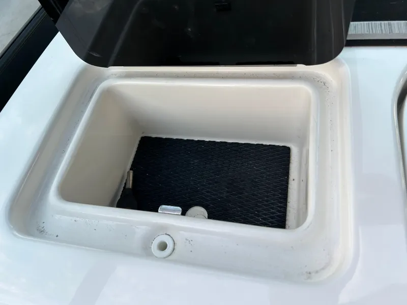 Slide: The Image of Open storage compartment on a 2022 Sea Ray SDX 270 Outboard boat. - 44