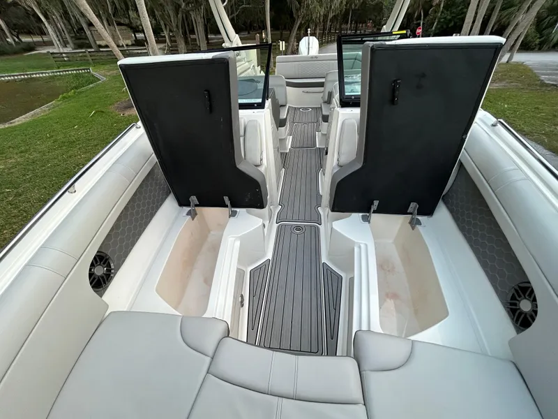 Slide: The Image of 2022 Sea Ray SDX 270 Outboard boat interior with open storage compartments. - 47