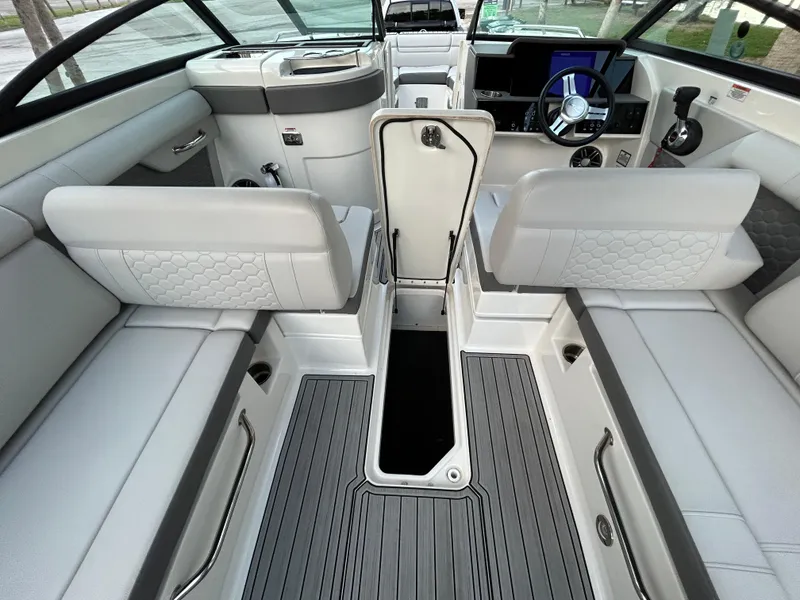 Slide: The Image of 2022 Sea Ray SDX 270 Outboard interior, featuring spacious seating and modern design. - 48