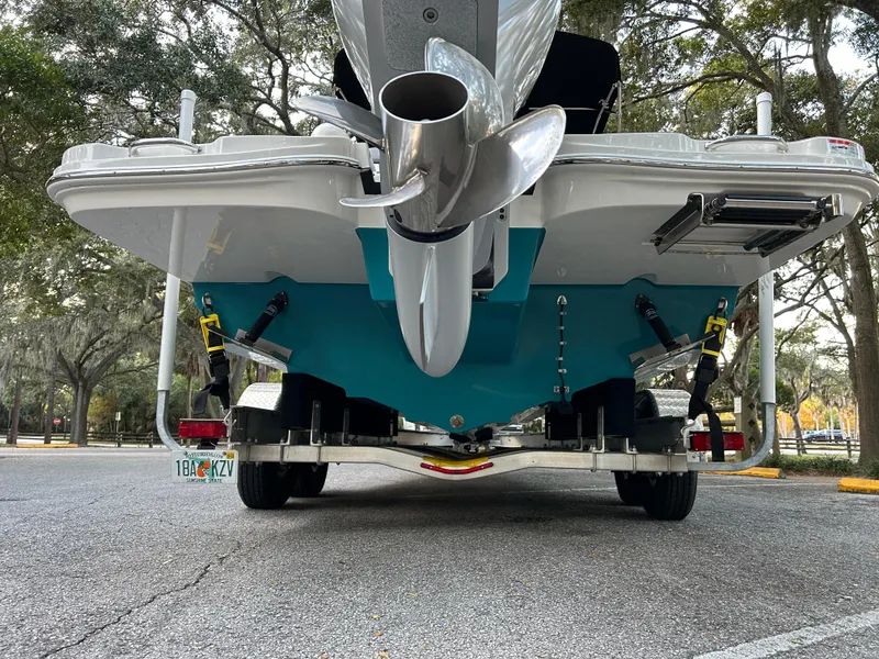 Slide: The Image of 2022 Sea Ray SDX 270 Outboard boat rear view with propeller and trailer. - 6