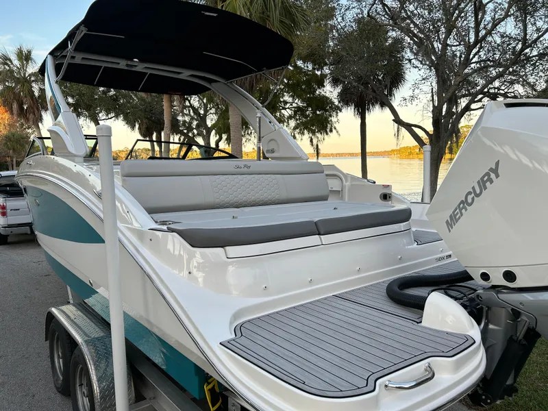 Slide: The Image of 2022 Sea Ray SDX 270 Outboard boat with Mercury engine, docked near a lake. - 8