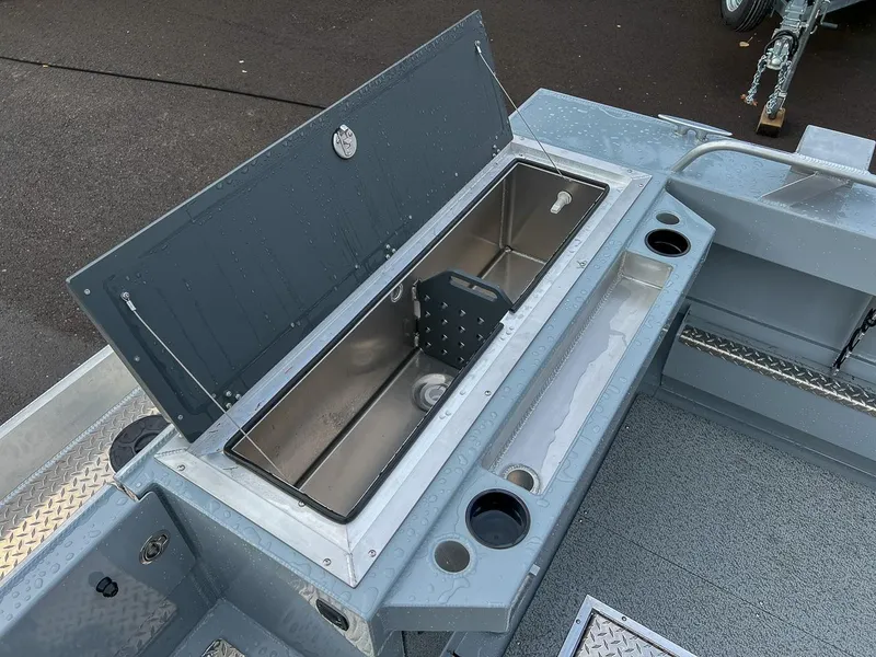 Slide: The Image of 2025 Hewescraft 210 Sea Runner ET boat interior with open storage compartment. - 16