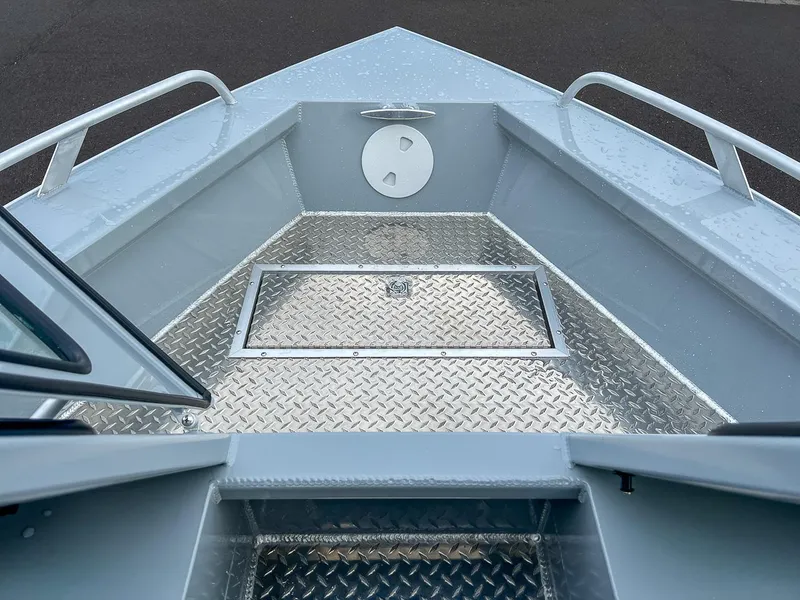 Slide: The Image of 2025 Hewescraft 210 Sea Runner ET boat deck with diamond plate flooring. - 8