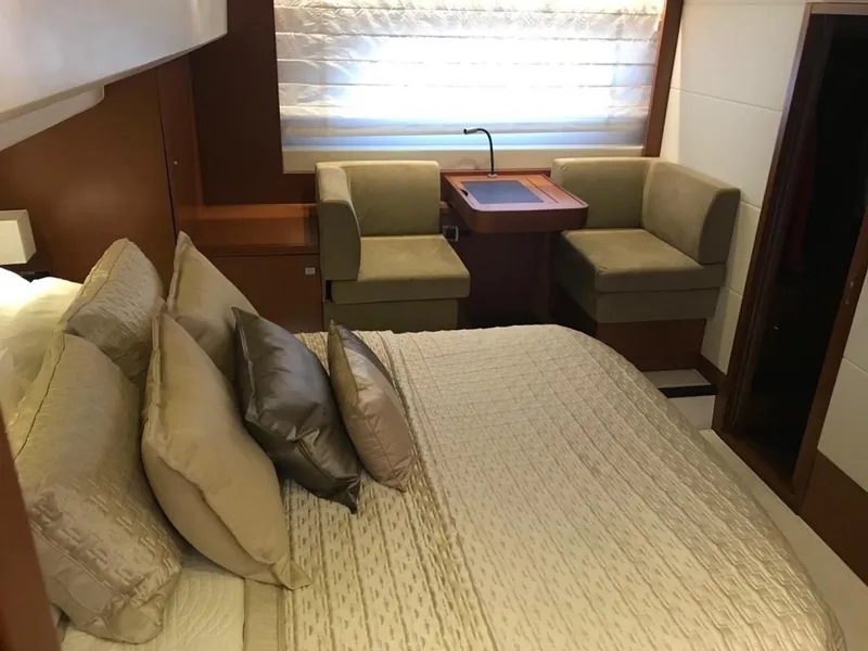 Slide: The Image of Luxurious bedroom interior of 2015 Prestige 550 yacht with elegant bedding and seating area. - 21