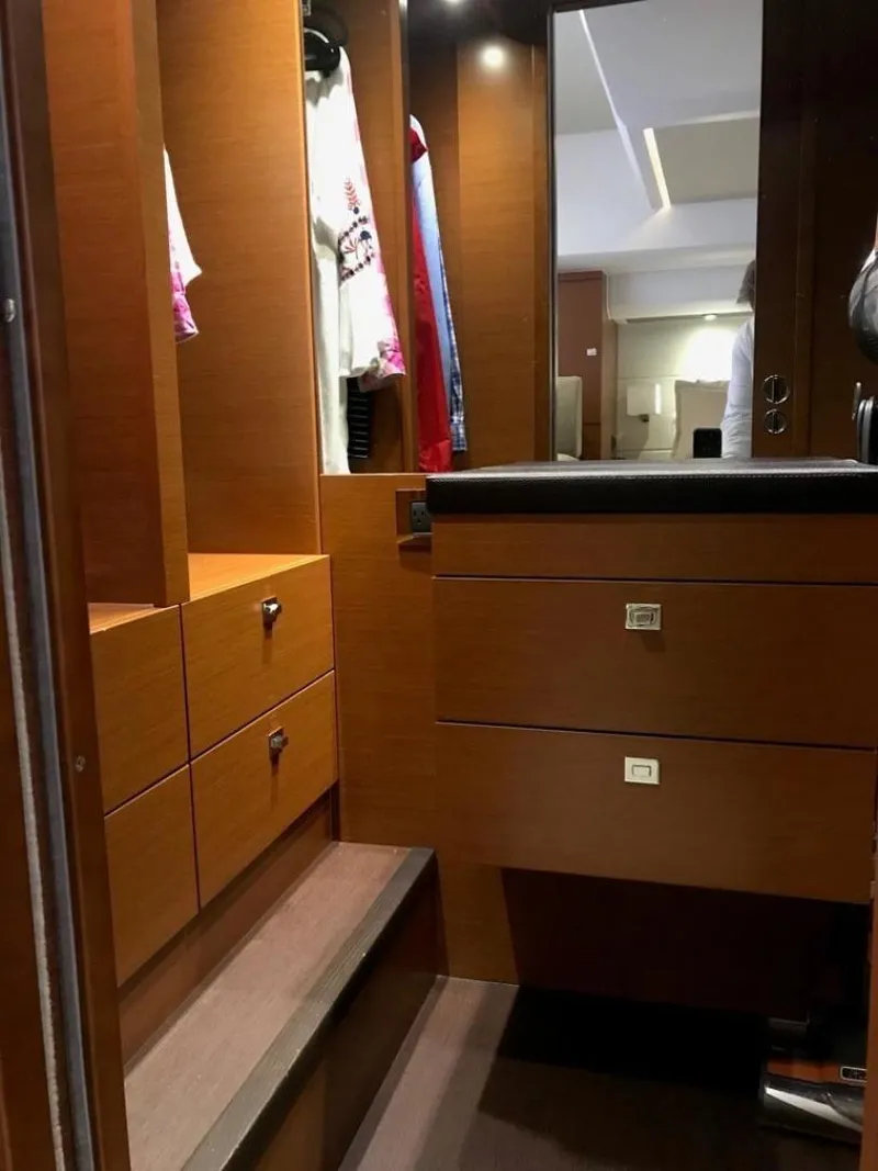 Slide: The Image of Luxurious wooden closet interior on a 2015 Prestige 550 yacht. - 23