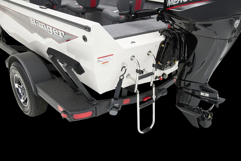 Slide: The Image of 2024 Ranger VS1665T boat interior with three black seats and gray carpet. - 9