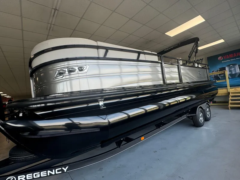 The Image of 2024 Regency 250 DL3 pontoon boat in showroom. - 1