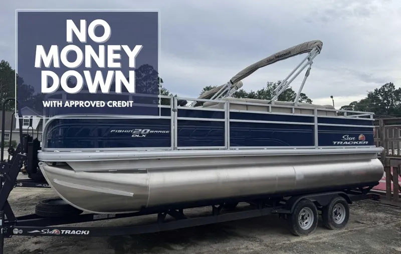 The Image of 2024 Sun Tracker Fishin' Barge 20 DLX pontoon boat on trailer, side view. - 0