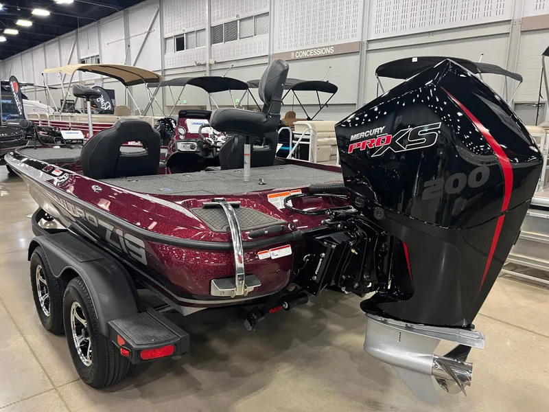Slide: The Image of 2024 Nitro Z19 Pro bass boat with Mercury Pro XS 200 engine in showroom. - 2