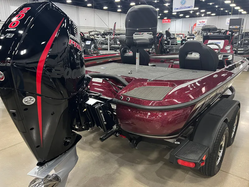 Slide: The Image of 2024 Nitro Z19 Pro bass boat with powerful outboard motor in showroom. - 3
