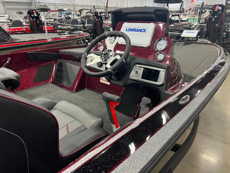 Slide: The Image of 2024 Nitro Z19 Pro boat interior with steering wheel and Lowrance electronics. - 4