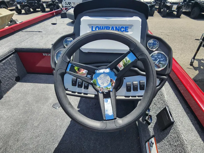 Slide: The Image of 2024 Ranger RT188C boat dashboard with steering wheel and Lowrance display. - 3