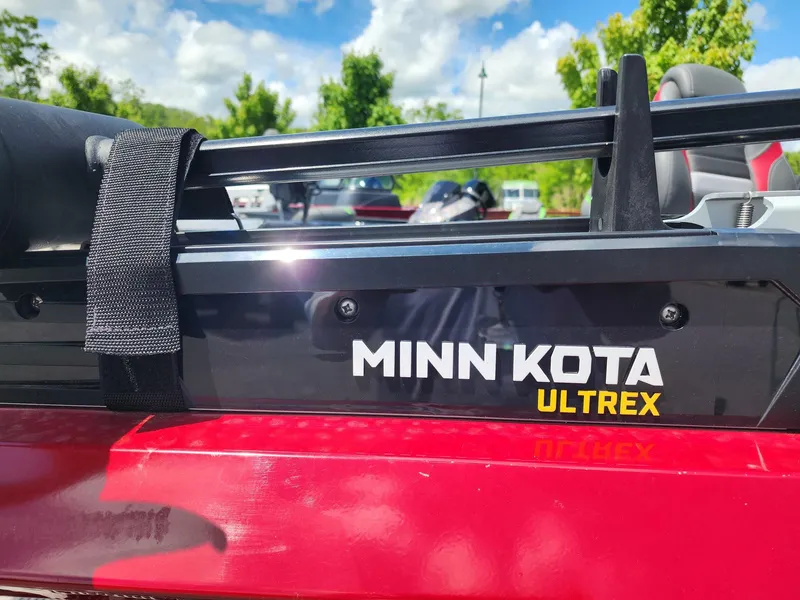 Slide: The Image of 2024 Ranger RT188C boat with Minn Kota Ultrex motor, outdoors on a sunny day. - 4