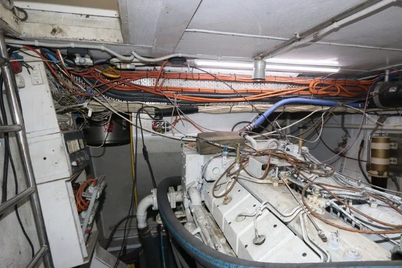 Slide: The Image of Engine room of a 1996 Mares Motor Yacht with visible wiring and machinery. - 8