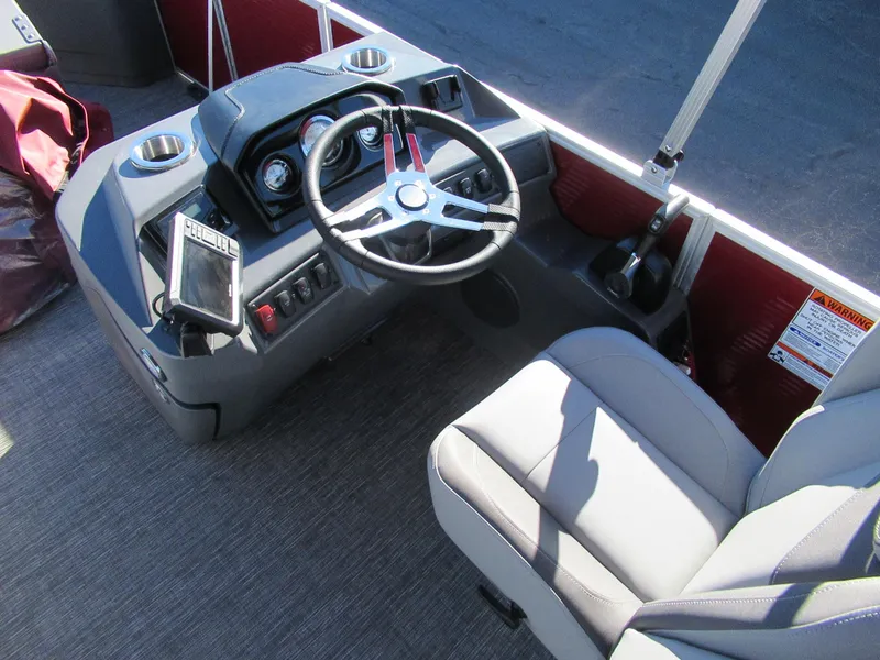 Slide: The Image of 2024 Bennington 22 SVF boat helm with steering wheel and captain's chair. - 3
