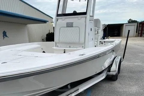 Slide: The Image of 2024 Sea Fox 231 Bay Fox boat on a trailer outside a storage facility. - 11