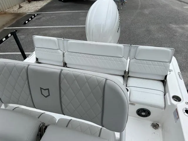 Slide: The Image of 2024 Sea Fox 231 Bay Fox boat with white and gray cushioned seating. - 3