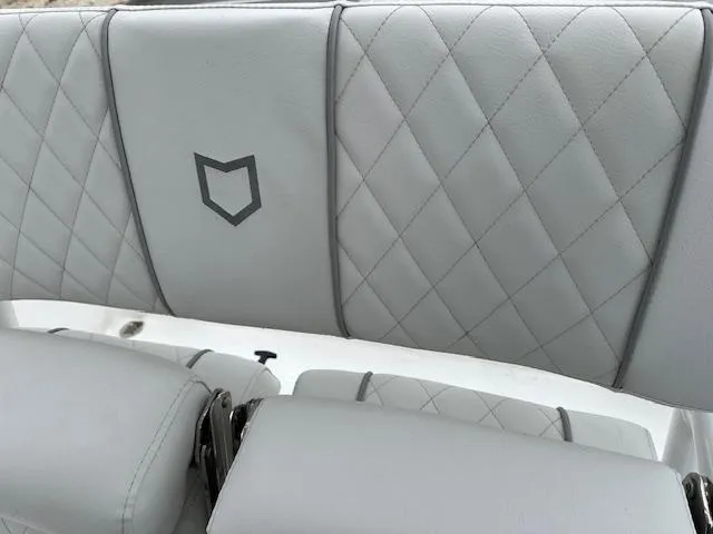 Slide: The Image of 2024 Sea Fox 231 Bay Fox boat with diamond-stitched gray upholstery. - 4