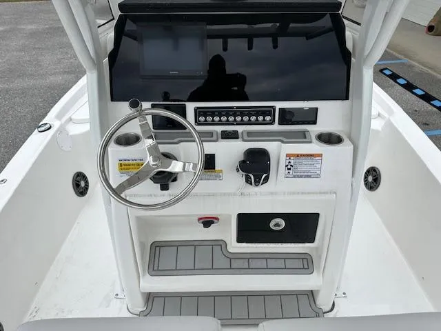 Slide: The Image of 2024 Sea Fox 231 Bay Fox boat console with steering wheel and control panel. - 5