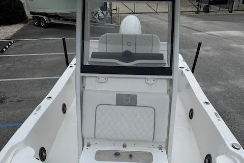 Slide: The Image of 2024 Sea Fox 231 Bay Fox boat interior with white seating and console. - 7