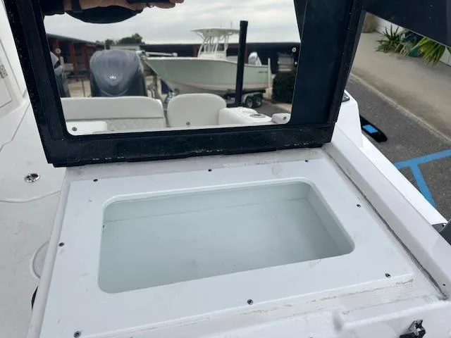 Slide: The Image of 2024 Sea Fox 268 Traveler boat with open storage compartment. - 14