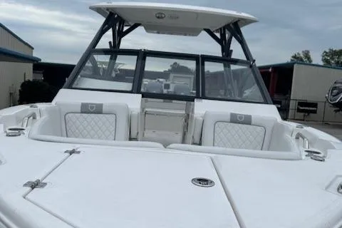 Slide: The Image of 2024 Sea Fox 268 Traveler boat with white seating and black frame. - 16