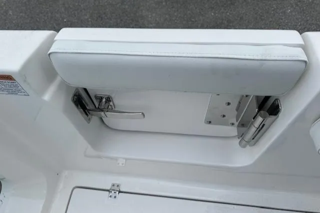 Slide: The Image of 2024 Sea Fox 268 Commander boat interior detail with white cushioned seating and stainless steel hardware. - 10